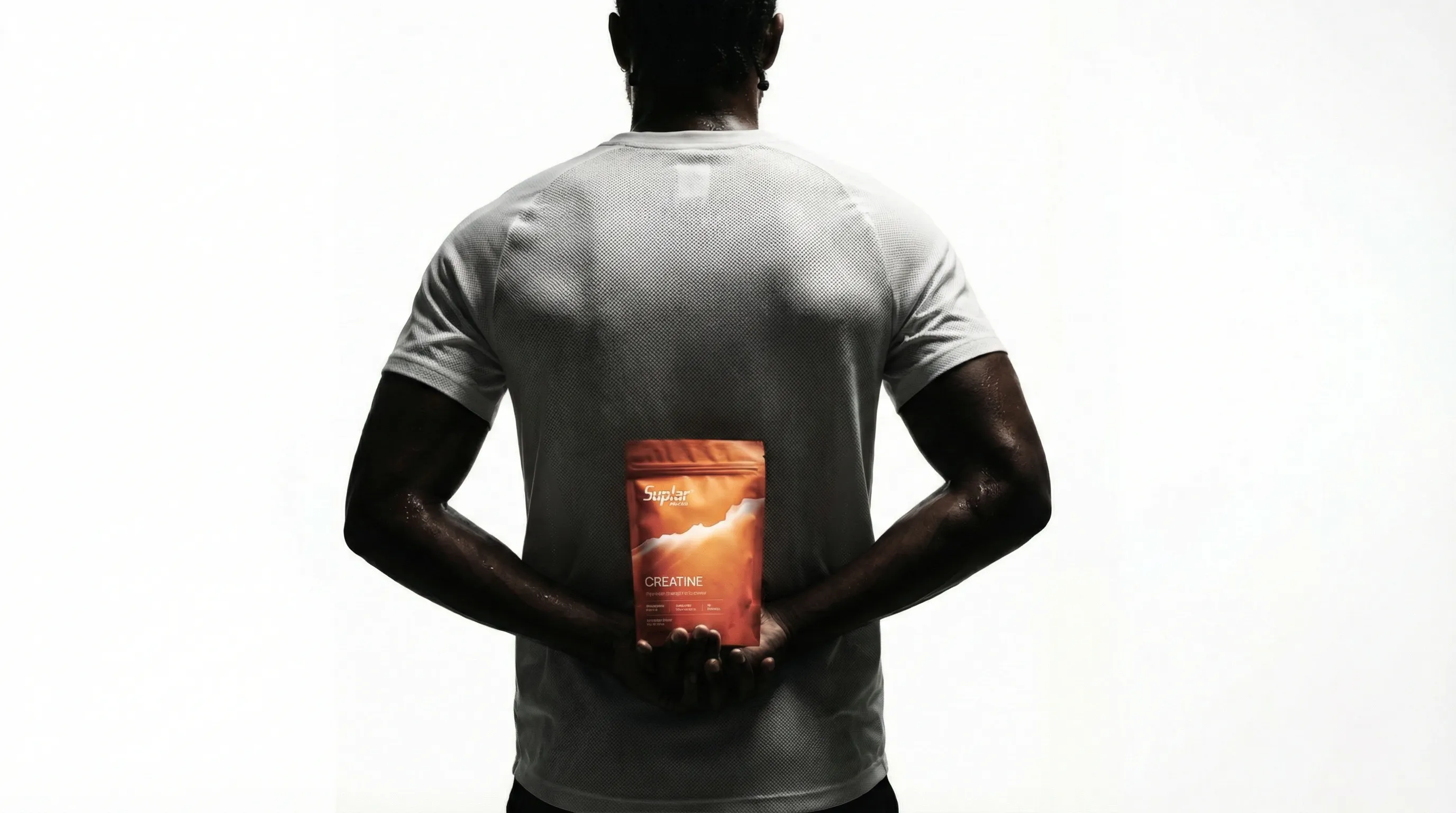 Suplar Athletics snowboarder riding down mountain slope